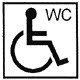 Symbol, person i rullstol. Text: WC